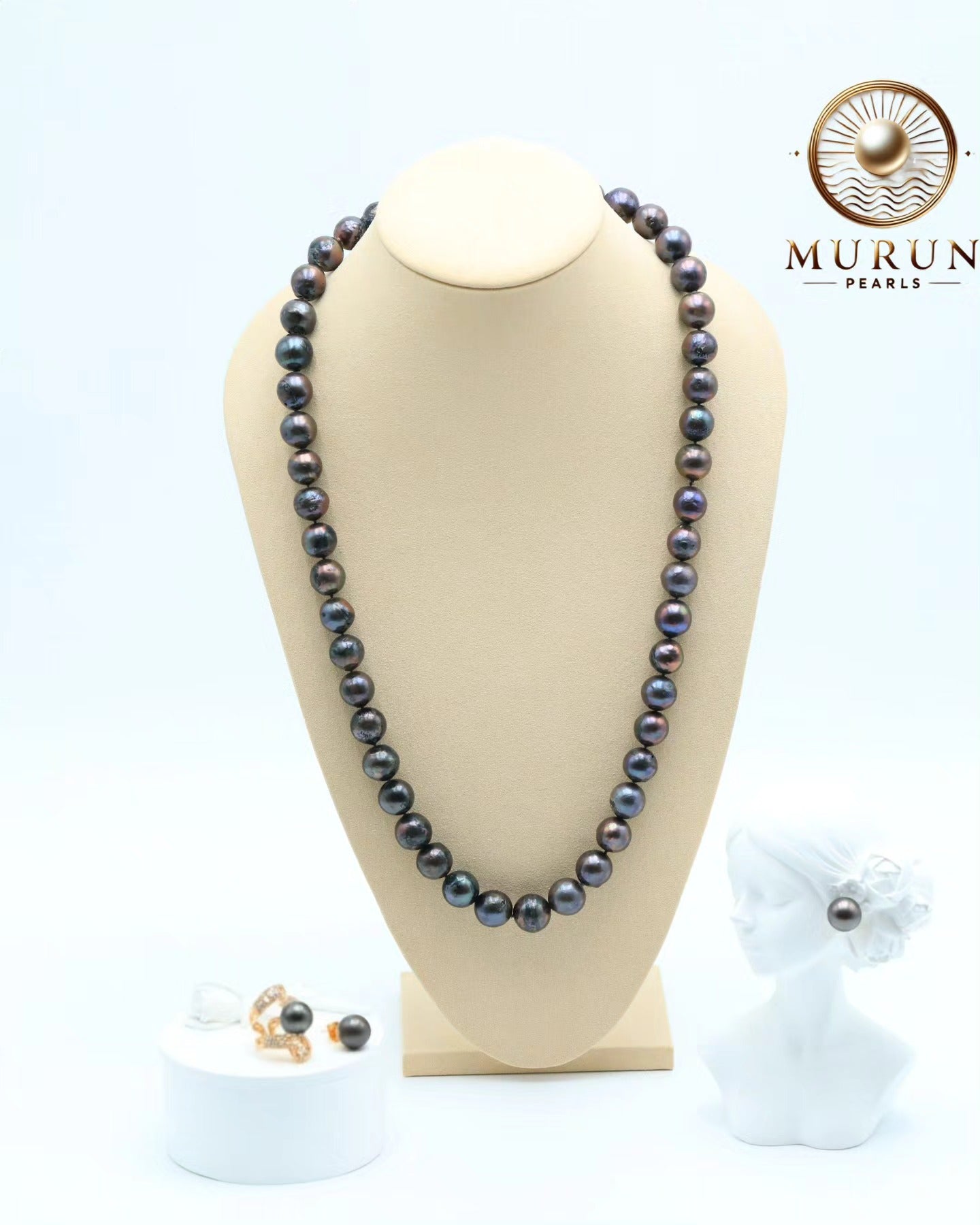 Murun Pearls' Tahitian black pearl jewelry set featuring a long strand necklace and rose gold drop earrings – bold, timeless elegance for modern luxury.