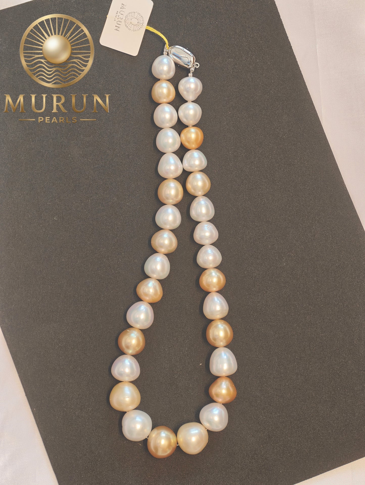 Experience the elegance of natural luxury with our Golden & White South Sea Pearl Necklace.